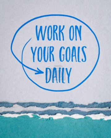 Photo for Work on your goals daily - motivational reminder, handwriting on art paper, goal setting, business and personal development concept - Royalty Free Image