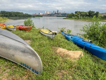 Photo for Kansas City, KS - July 31, 2023: Kayak and canoes at Kaw Point Park, confluence of the Missouri and Kansas Rivers, with a cityscape of Kansas City, MO. - Royalty Free Image