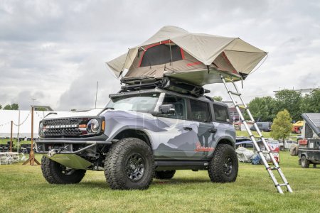 Photo for Loveland, CO, USA - August 26, 2023: Ford Bronco Sport SUV with custom body paint, off  road modifications and roof tent. - Royalty Free Image