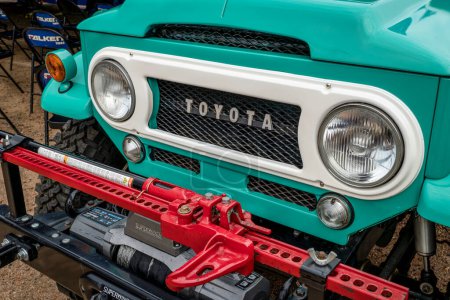 Photo for Loveland, CO, USA - August 26, 2023: Front and grille of of beautifully restored vintage Toyota Land Cruiser with a modern bumper, winch, and high lift jack. - Royalty Free Image