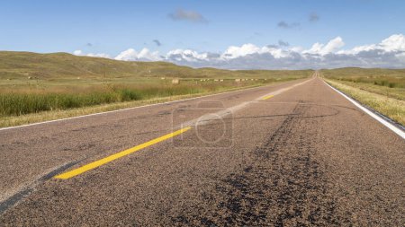 Photo for Rural highway across Nebraska Sandhills on a sunny late summer day, travel or journey concept - Royalty Free Image