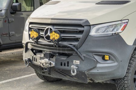 Photo for Loveland, CO, USA - August 26, 2023:  Grille and front bumper of Mercedes Sprinter camper van with LED off-road headlights, winch and heavy shackles. - Royalty Free Image