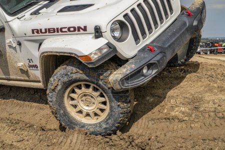 Photo for Loveland, CO, USA - August 27, 2023: Jeep Wrangler, Rubicon model, on a muddy training drive off-road course - Royalty Free Image
