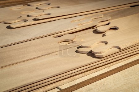 Photo for Narrow panels of okoume plywood with puzzle joints in stittch-and-glue boat building kit - Royalty Free Image
