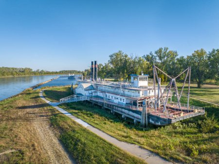 Photo for Brownville, NE, USA - October 6, 2023:  Historic dredge, Captain Meriwether Lewis, in a dry dock on a shore of Missouri River, aerial view. - Royalty Free Image