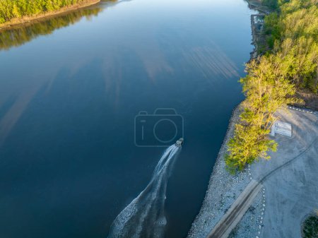Photo for Fishing boat leaving a ramp - sunrise aerial view of Missouri River at Dalton Bottom - Royalty Free Image