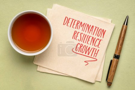 Photo for Determination, resilience, growth - motivational power words on a napkin with a cup of tea - Royalty Free Image