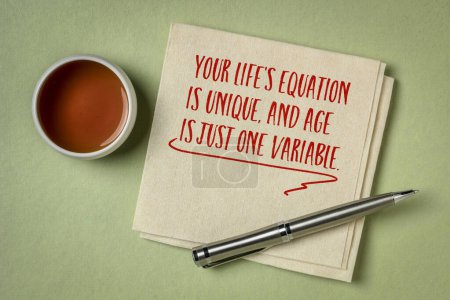 Photo for Your life's equation is unique, and age is just one variable - inspirational note on a napkin, healthy aging and personal development concept - Royalty Free Image