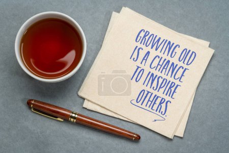 Photo for Growing old is a chance to inspire others - inspirational note on a napkin, aging and personal development concept - Royalty Free Image