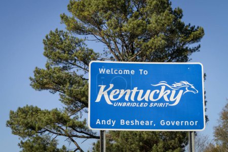 Photo for Welcome to Kentucky, Unbridled Spirit - roadsign at state border with Tennessee with a pine tree in background. - Royalty Free Image