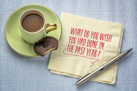 Photo for What do you wish you had done in the past year? Self reflection question on a napkin. Review of failures in the past year. - Royalty Free Image