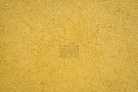 Photo for Closeup background of yellow Huun Mayan handmade paper created in Mexico - Royalty Free Image