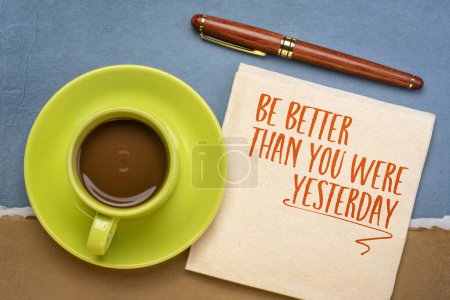 Photo for Be better than you were yesterday - motivational text on a napkin with coffee, personal development concept. - Royalty Free Image