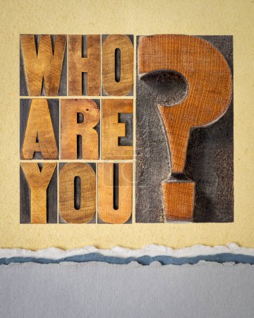 Photo for Who are you question - word abstract in letterpress wood type blocks on art paper, identity and personal development concept - Royalty Free Image