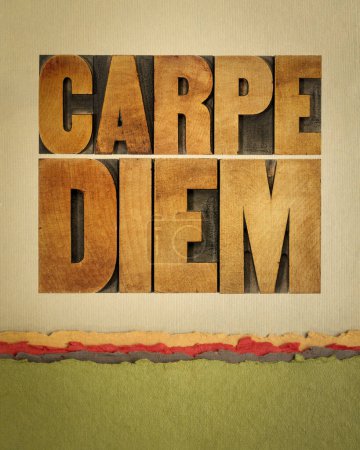 Photo for Carpe Diem  - enjoy life before it is too late, existential cautionary Latin phrase by Horace -  text in vintage letterpress wood type on art paper - Royalty Free Image