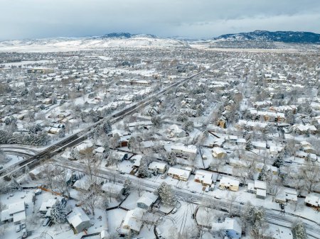 Photo for Winter morning over city of Fort Collins and Front Range of Rocky Mountains in northern Colorado, aerial view - Royalty Free Image