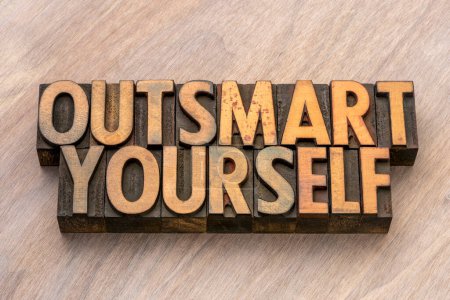 outsmart yourself words in letterpress wood type, overcoming self-imposed limitations, biases, and obstacles in order to achieve personal growth, success, and fulfillment