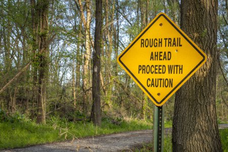 Photo for Rough trail ahead, proceed with caution - warning sign on Steamboat Trace Trail converted from old railroad near Peru, Nebraska - Royalty Free Image