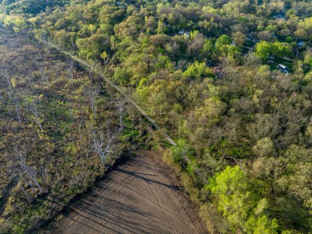 Photo for Steamboat Trace, bike trail converted from an abandoned railroad at Peru, Nebraska, springtime aerial view - Royalty Free Image