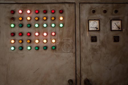 Photo for Old and rustic electrical control panel with red, green, and yellow lights - Royalty Free Image