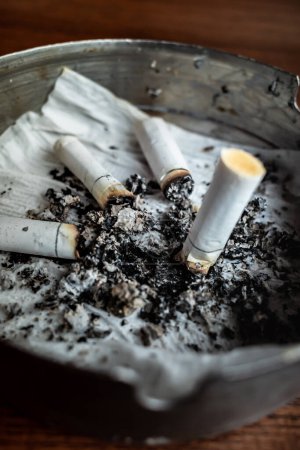 Photo for Burnt cigarettes in an ashtray - Royalty Free Image
