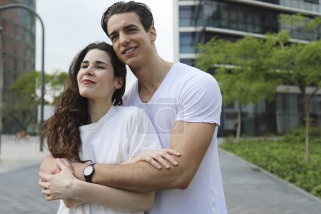 Photo for Couple smiling confident hugging each other at street - Royalty Free Image