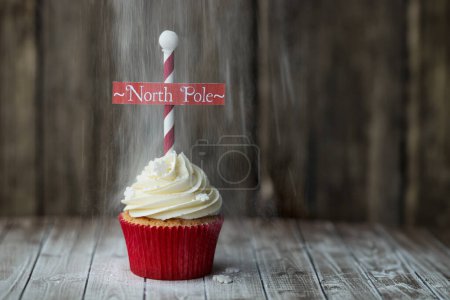 Photo for Christmas North Pole cupcake with a dusting of powdered sugar - Royalty Free Image