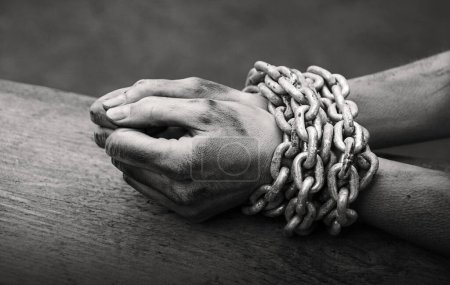 Photo for Close up view old law danger fear stress young male guy boy ask god hold  help hope life wood text space. Closeup limit addict pain bind lady fist wrist iron rope knot trap restrain forbid body abuse - Royalty Free Image
