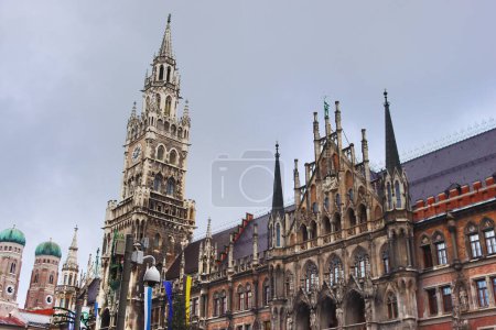 Photo for New city hall and towers of Frauenkirche Cathedral (left) in Munich, Bavaria, Germany - Royalty Free Image