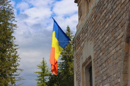 Romanian flag on  Cantacuzino Castle, Busteni, Romania