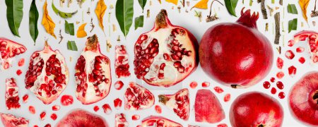 Photo for Pomegranate fruit piece, slice and leaf collection. Flat lay, seamless abstract on gray background. - Royalty Free Image
