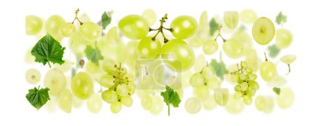 Photo for Abstract background made of Green Grape fruit pieces, slices and leaves isolated on white. - Royalty Free Image
