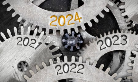 Photo for Photo of tooth wheel mechanism with numbers 2024, 2023, 2022 imprinted on metal surface. New Year concept. - Royalty Free Image