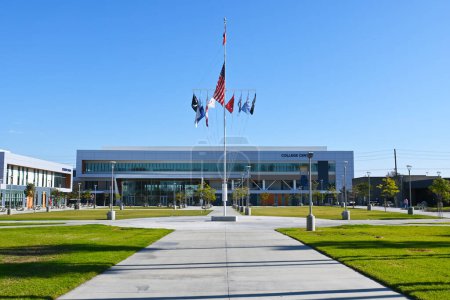 Photo for COSTA MESA, CALIFORNIA - 19 DEC 2022:  Main Quad with Flagpole and College Center buildign on the Campus of Orange Coast College, OCC. - Royalty Free Image