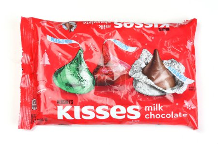 Photo for IRIVNE, CALIFORNIA - 23 DEC 2022: A bag of Hersheys Milk Chocolate Kisses wrapped in Christmas Colors. - Royalty Free Image