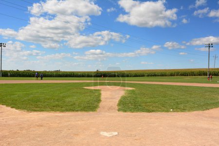 Photo for DYERSVILLE, IOWA - AUGUST 20, 2015: Field of Dreams movie set. Children and adults on the diamond of the 1989 movie set. - Royalty Free Image