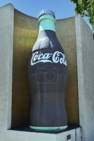Photo for LOS ANGELES, CALIFORNIA - 17 MAY 2023: Giant soda bottle at the Coca-Cola Bottling Co plant on Central Avenue in South LA. - Royalty Free Image