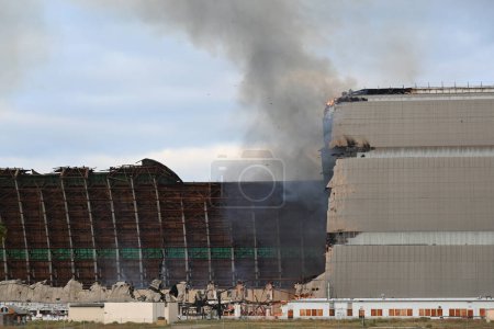 Photo for TUSTIN, CALIFORNIA - 7 NOV 2023: The MCAS Tustin Blimp Hangar on fire. - Royalty Free Image