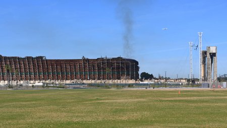 Photo for TUSTIN, CALIFORNIA - 13 NOV 2023: The Tustin MCAS Blimp Hangar Fire,  still smoldering as the North wall slowly burns away. - Royalty Free Image