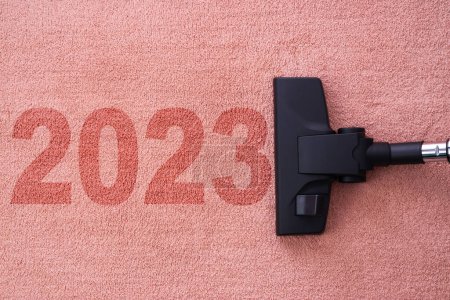 Photo for Refreshing in the New year 2023 concept for cleaning home cleaning with vacuum cleaner on carpet and copy space for a text - Royalty Free Image