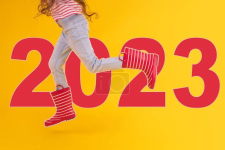 Photo for 2023 lifestyle concept of jumping girl toward new year. Christmas and New year banner for business, sport and shopping - Royalty Free Image
