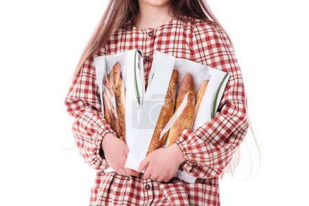 Téléchargez les photos : Girl baker in vintage dress serving freshly baked homemade bread rolls with cheese - en image libre de droit
