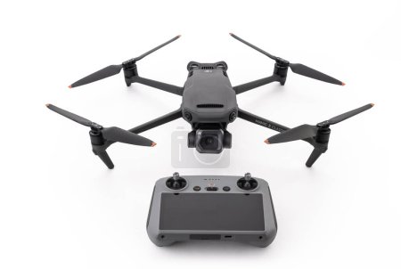 Photo for Varna, Bulgaria - February 17, 2023: A new modern DJI Mavic 3 CLASSIC drone and remote controller. Quadcopter drone aircraft with digital camera for aerial pictures and video, isolated on white background - Royalty Free Image