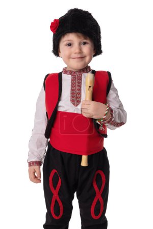 Foto de Bulgarian boy musician with flute in traditional folklore costume with martenitsa symbol of spring, Baba Marta and Easter holiday, portrait on white background.Martisor - Imagen libre de derechos