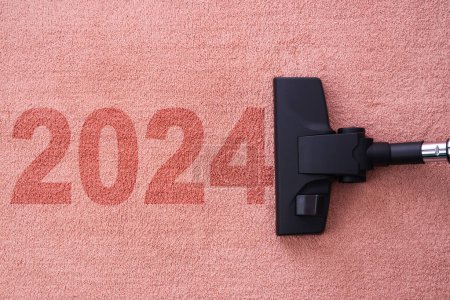 Photo for 2024 New year text n carpet, home cleaning with vacuum cleaner and copy space for a text - Royalty Free Image