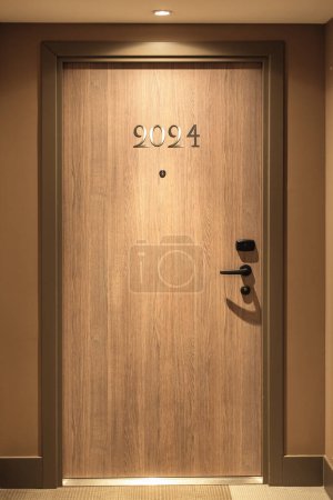 Photo for Happy New Year 2024 number over luxury hotel door, rental staying, travel and living concept - Royalty Free Image