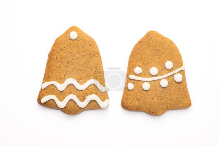 Photo for Gingerbread cookie of a Christmas bell with icing isolated on white background - Royalty Free Image