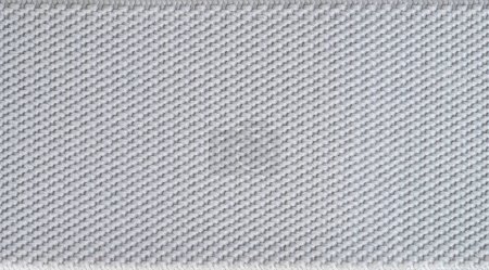 Grauer Stoff Textur Hintergrund. Muster aus gestrickter Baumwolle