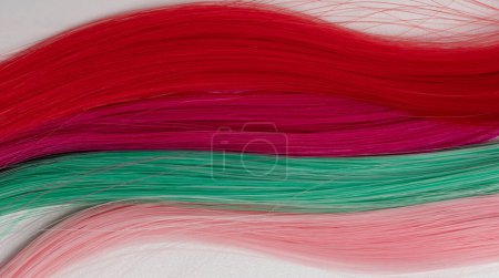 Synthetic colorful hair background macro close up view