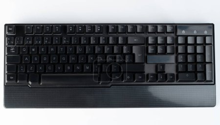 Black office keyboard with full numpad above top view isolated